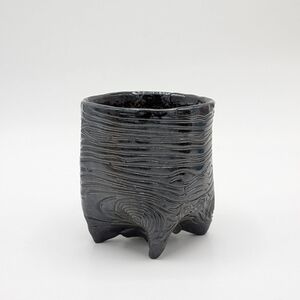 Textured Black Ceramic Planter with Sculpted Woodgrain Pattern